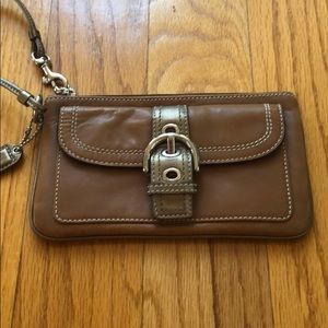 Coach wristlet with buckle detail